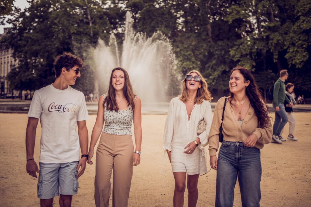 Group of Erasmus students in a square in Tallinn discussing the benefits of an Erasmus semester.